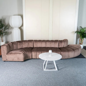 Cosmo modular sofa rental for event in Truffle Brown, styled with a round coffee table.