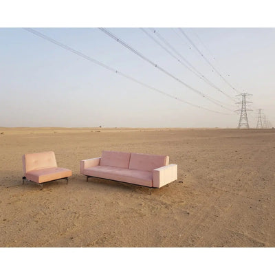 Enigma sofa with arm rest blush pink velvet Desert River Rentals