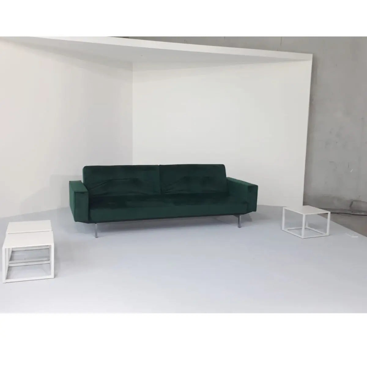 Enigma sofa with arm rest forest green velvet Desert River Rentals