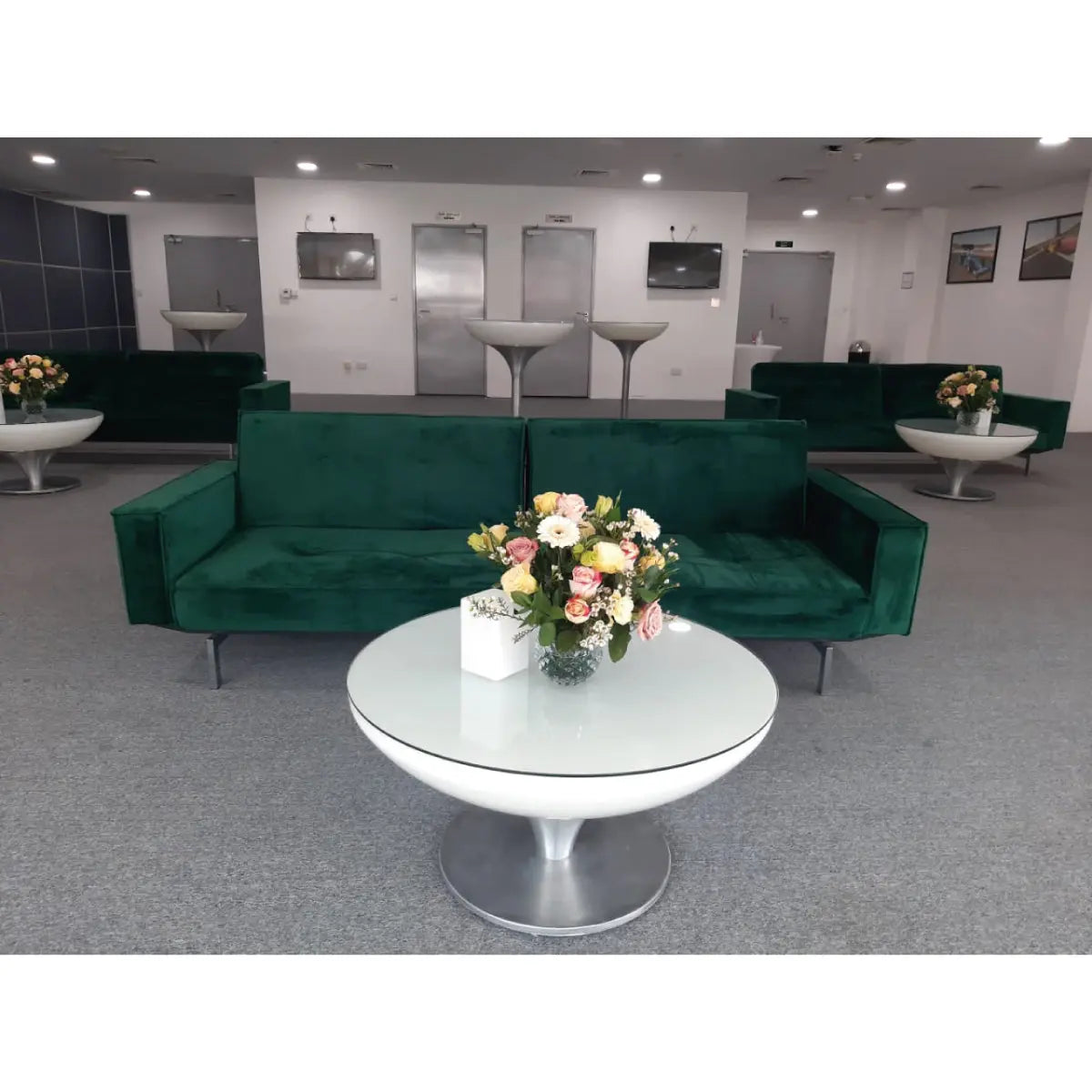 Enigma sofa with arm rest forest green velvet Desert River Rentals