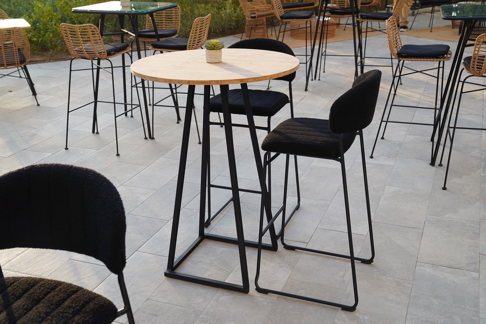 Linea Cocktail Table (Black Frame with Round Bamboo Top) Desert River Rentals