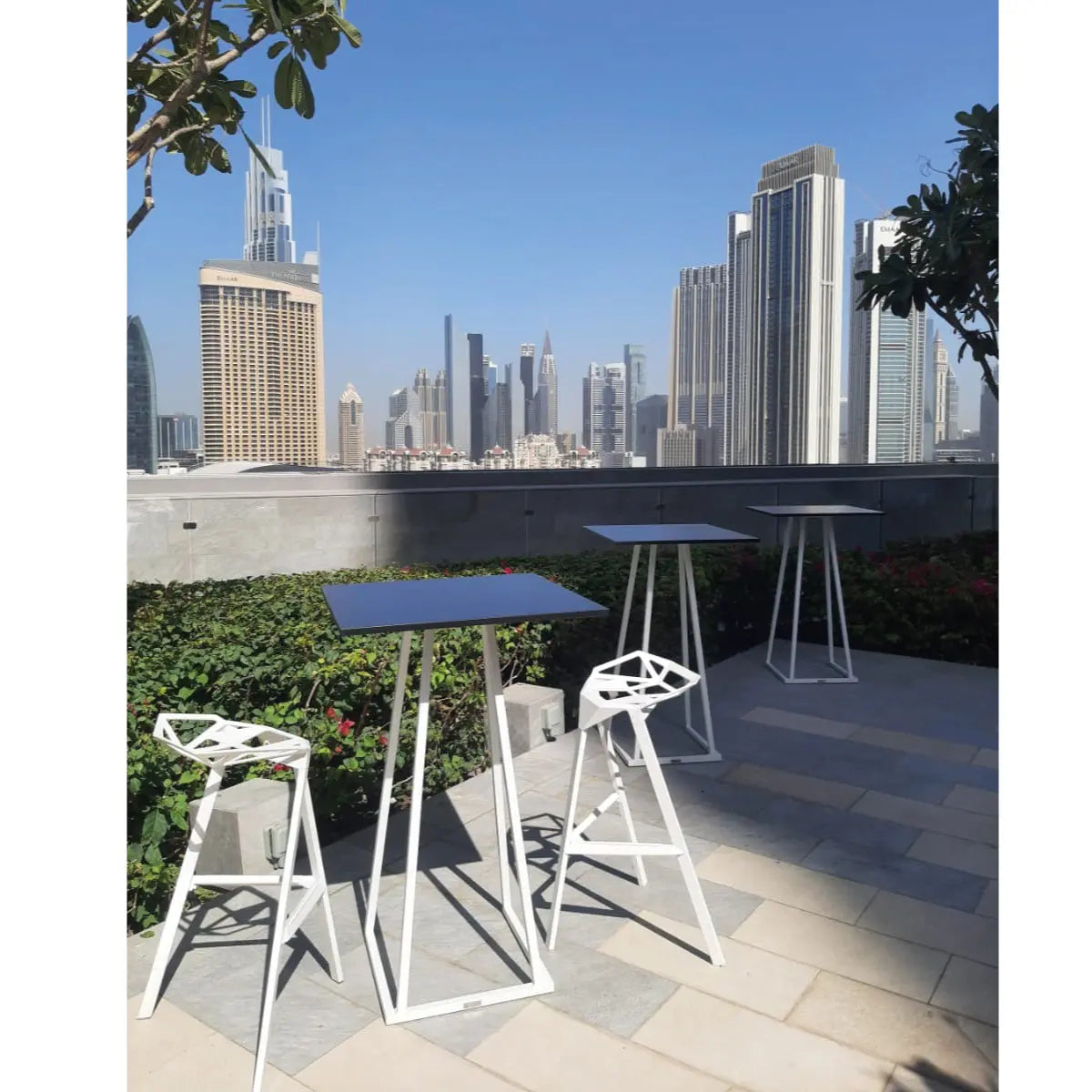 Linea cocktail table, white frame, black top Desert River Rentals