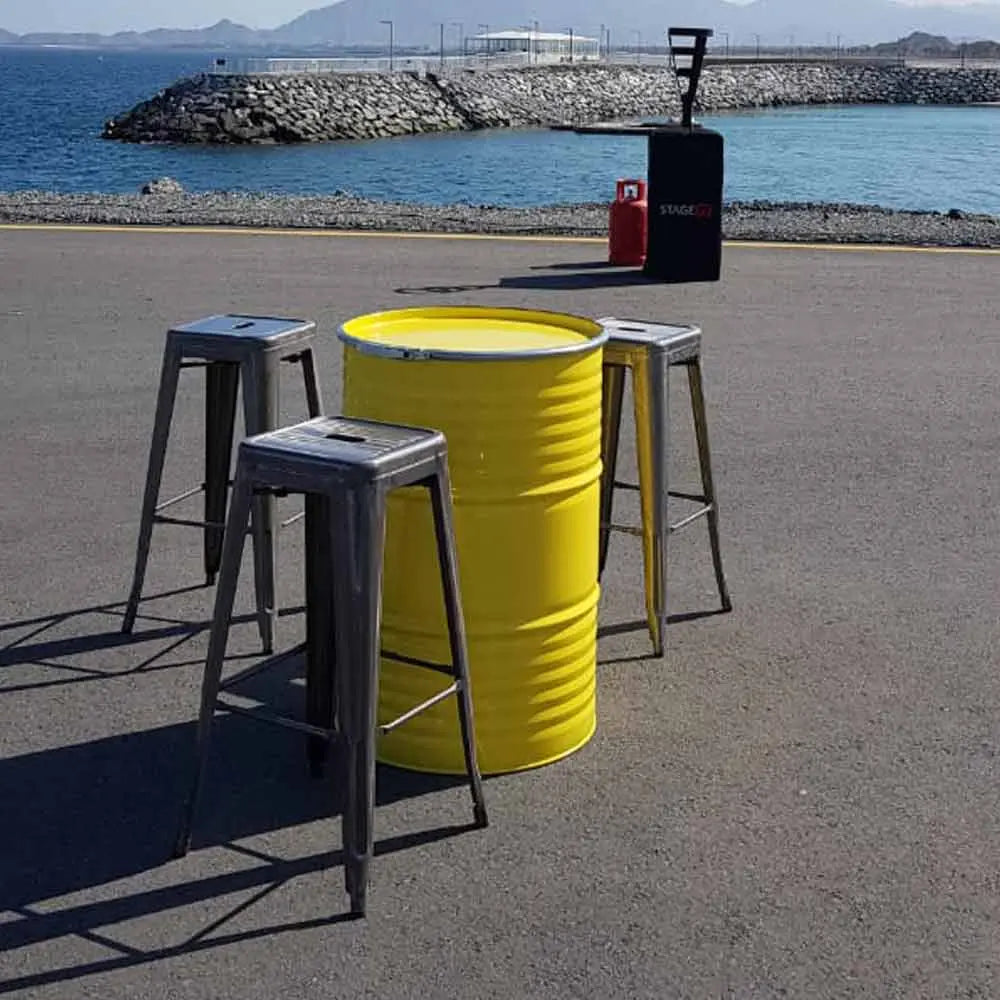Oil drum table yellow Desert River Rentals