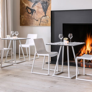 Modern white Linea dining table design on a cosy event setting in Dubai.